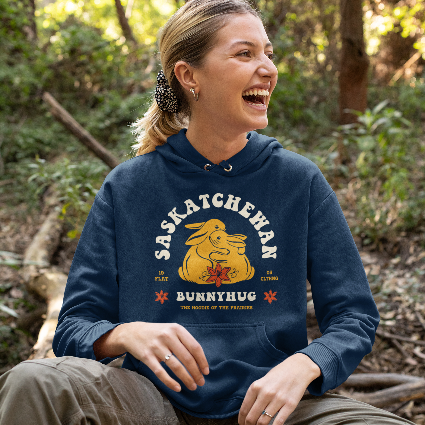 Woman wearing a hoodie with bunnies hugging, called a bunnyhug in Saskatchewan